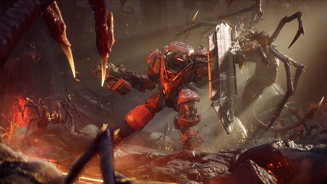 Mecha vermelho fortemente armado de Anthem em cenário de combate com lava e monstros ao fundo.